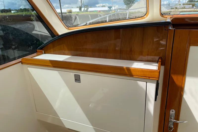  Yacht Photos Pics Interior view of 2006 Marlow 375 Prowler Classic yacht with wood accents and window.