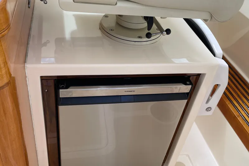  Yacht Photos Pics 2006 Marlow 375 Prowler Classic interior with Dometic fridge and helm seat.