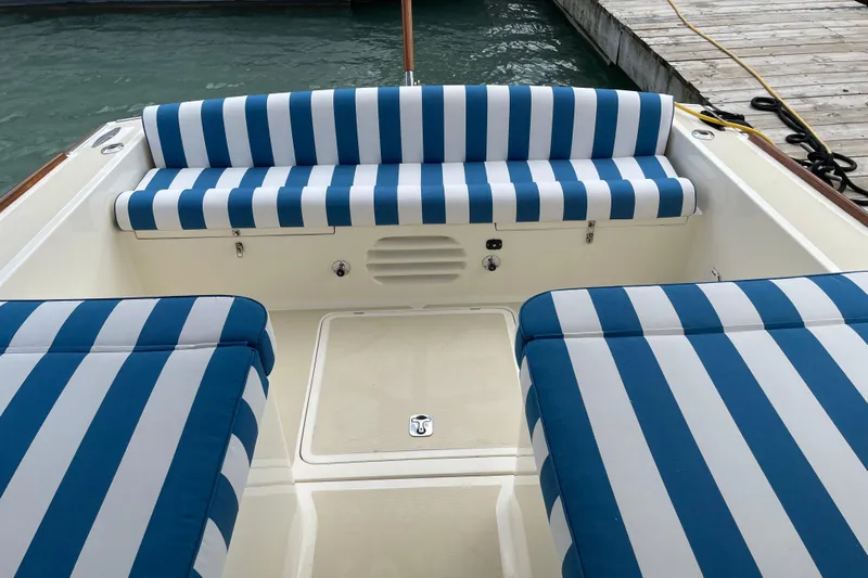  Yacht Photos Pics 2006 Marlow 375 Prowler Classic boat with blue and white striped seating.