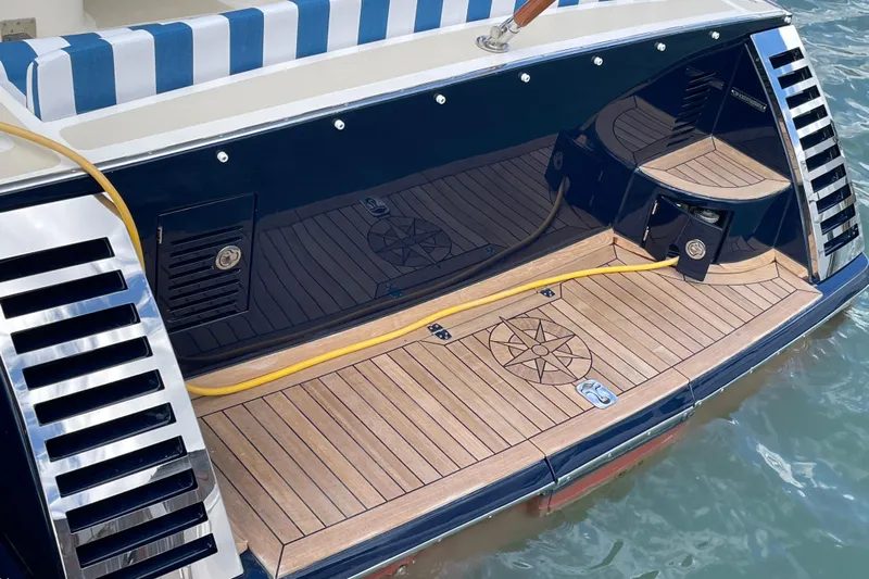  Yacht Photos Pics Luxury Marlow 375 Prowler Classic 2006 yacht with elegant teak deck and striped seating.