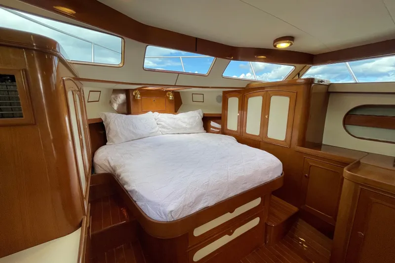  Yacht Photos Pics Luxurious cabin interior of 2006 Marlow 375 Prowler Classic yacht with wood finish.