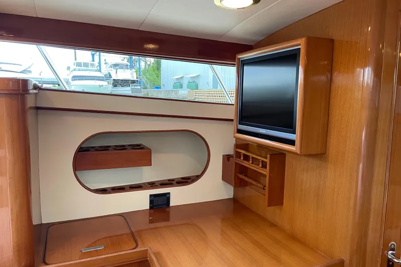  Yacht Photos Pics Interior of 2006 Marlow 375 Prowler Classic with wood finish and mounted TV.
