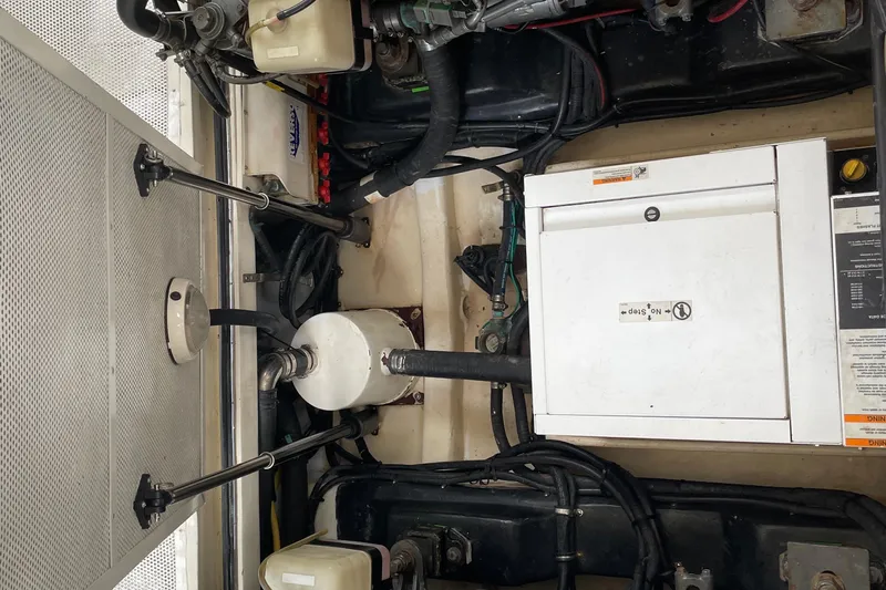  Yacht Photos Pics Engine compartment of a 2006 Marlow 375 Prowler Classic, showcasing mechanical components and wiring.