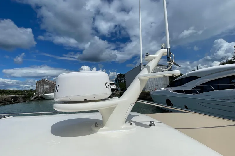 Yacht Photos Pics 2006 Marlow 375 Prowler Classic yacht with radar, docked under a cloudy sky.