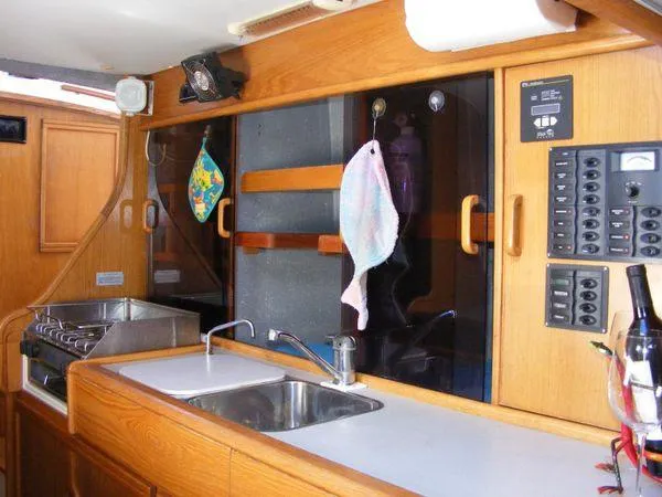 Makani Yacht Photos Pics Interior of 2008 Seawind 1000 XL with kitchen and controls.