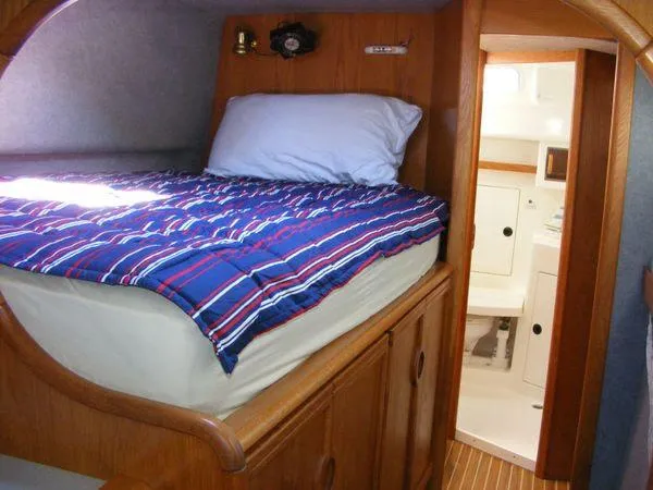 Makani Yacht Photos Pics Interior of a 2008 Seawind 1000 XL yacht with cozy bed.