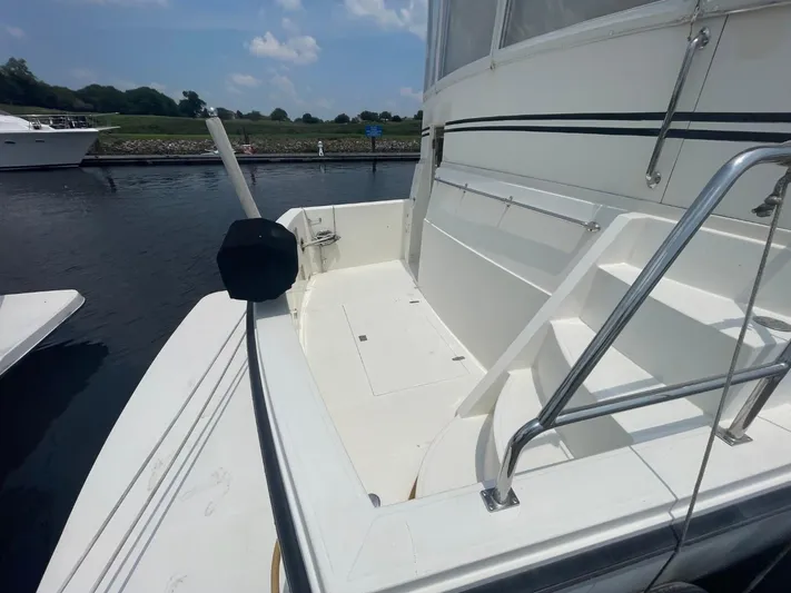 The Lucky Dreamers Yacht Photos Pics 2005 Novatec 48 Cockpit Motor Yacht docked, featuring spacious deck and sleek design.