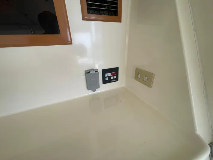 The Lucky Dreamers Yacht Photos Pics Control panel and switches on 2005 Novatec 48 Cockpit Motor Yacht interior.