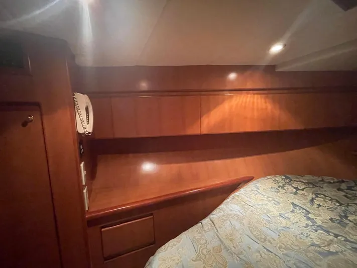 The Lucky Dreamers Yacht Photos Pics Luxurious wooden interior of 2005 Novatec 48 Cockpit Motor Yacht cabin.