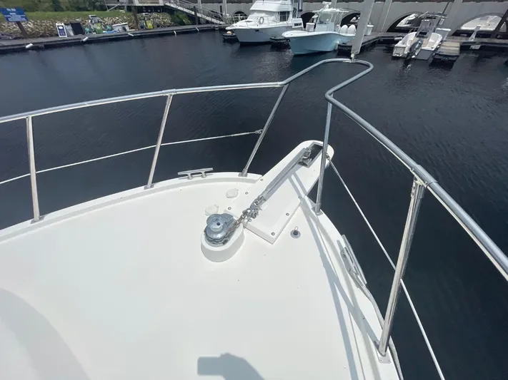 The Lucky Dreamers Yacht Photos Pics Bow view of 2005 Novatec 48 Cockpit Motor Yacht at marina.