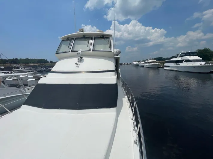 The Lucky Dreamers Yacht Photos Pics 2005 Novatec 48 Cockpit Motor Yacht docked on a sunny day.