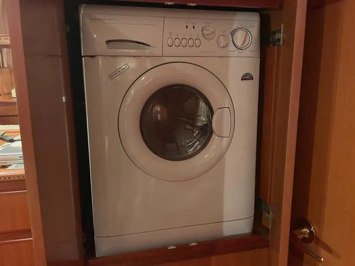 The Lucky Dreamers Yacht Photos Pics Washing machine inside 2005 Novatec 48 Cockpit Motor Yacht wooden cabinet.