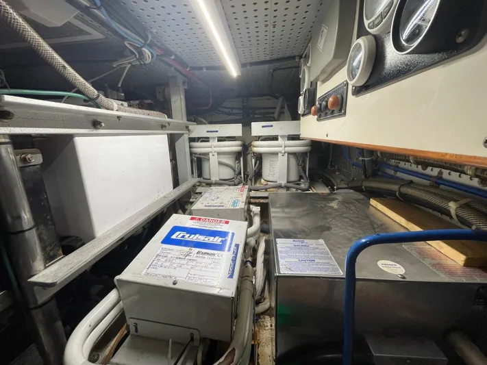 The Lucky Dreamers Yacht Photos Pics Engine room of 2005 Novatec 48 Cockpit Motor Yacht with mechanical equipment and gauges.