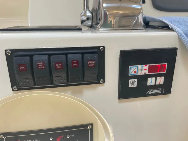 The Lucky Dreamers Yacht Photos Pics Control panel of a 2005 Novatec 48 Cockpit Motor Yacht with switches and digital display.