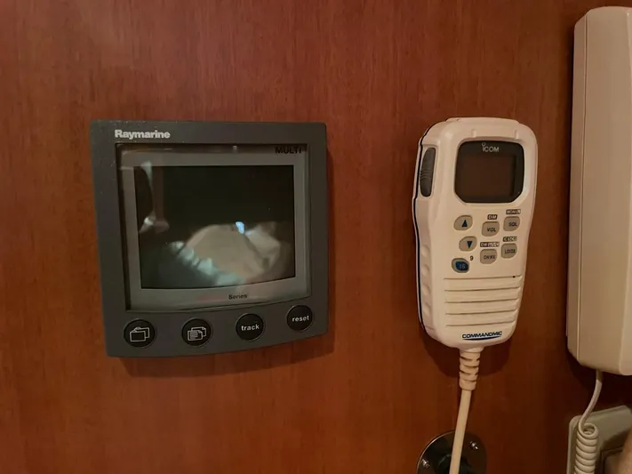 The Lucky Dreamers Yacht Photos Pics Raymarine display and Icom radio on 2005 Novatec 48 Cockpit Motor Yacht dashboard.