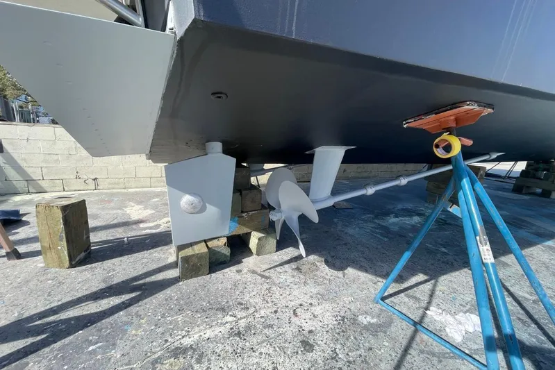 The Lucky Dreamers Yacht Photos Pics 2005 Novatec 48 Cockpit Motor Yacht under maintenance, showing propeller and hull details.