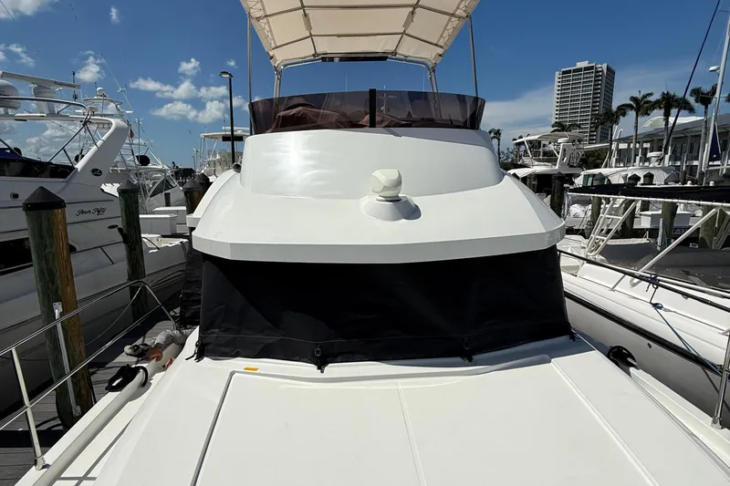  Yacht Photos Pics 2021 Beneteau Swift Trawler 35 docked at marina under clear blue sky.