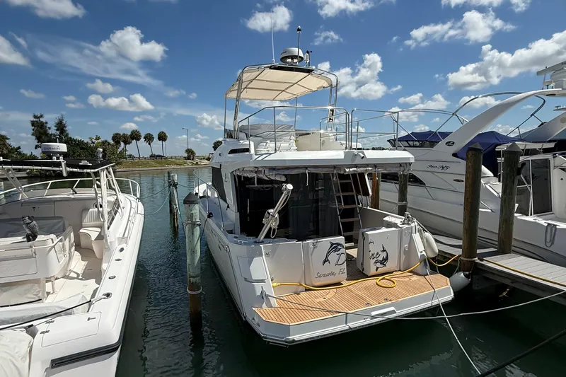 Yacht Photos Pics 2021 Beneteau Swift Trawler 35 docked at marina under blue sky.