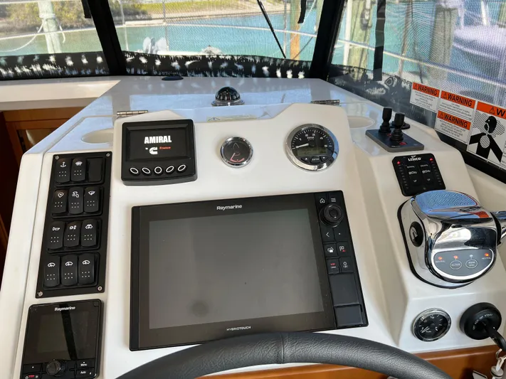  Yacht Photos Pics Helm station of 2021 Beneteau Swift Trawler 35 with navigation equipment.