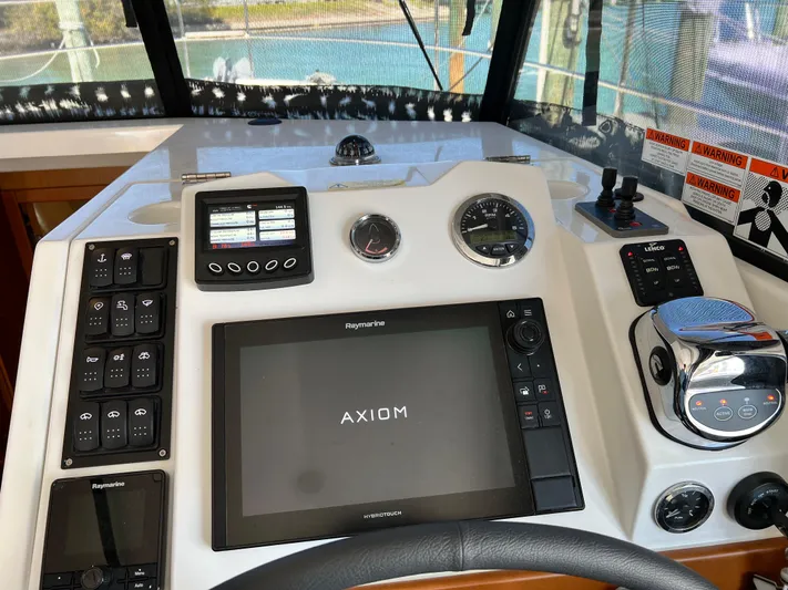  Yacht Photos Pics Helm station of 2021 Beneteau Swift Trawler 35 with Raymarine Axiom display.