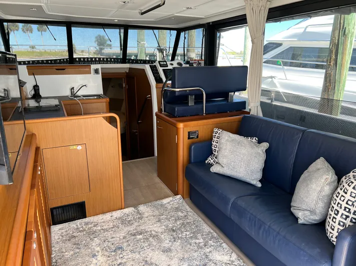  Yacht Photos Pics Interior of 2021 Beneteau Swift Trawler 35 with modern kitchen and cozy seating area.