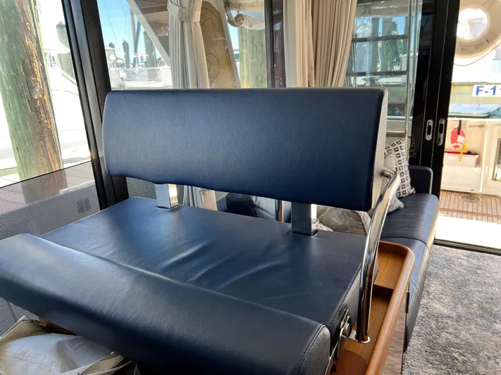  Yacht Photos Pics Interior seating of 2021 Beneteau Swift Trawler 35 with blue upholstery.
