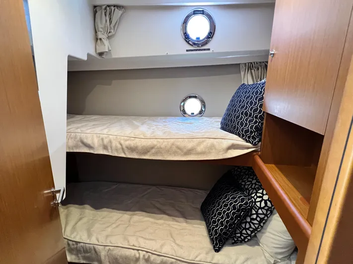  Yacht Photos Pics 2021 Beneteau Swift Trawler 35 cabin with bunk beds and porthole windows.