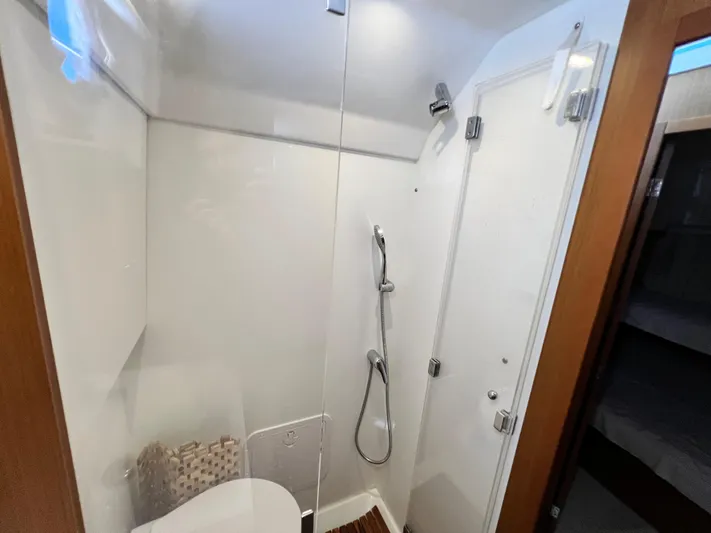  Yacht Photos Pics 2021 Beneteau Swift Trawler 35 bathroom with shower and modern fixtures.