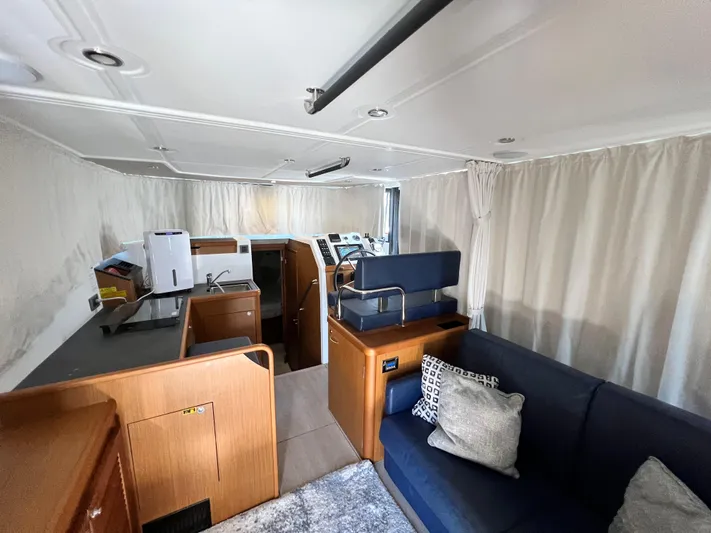  Yacht Photos Pics Interior of 2021 Beneteau Swift Trawler 35 with modern furnishings and helm station.