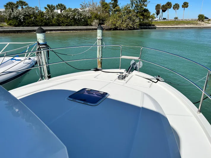  Yacht Photos Pics 2021 Beneteau Swift Trawler 35 docked in a serene marina.