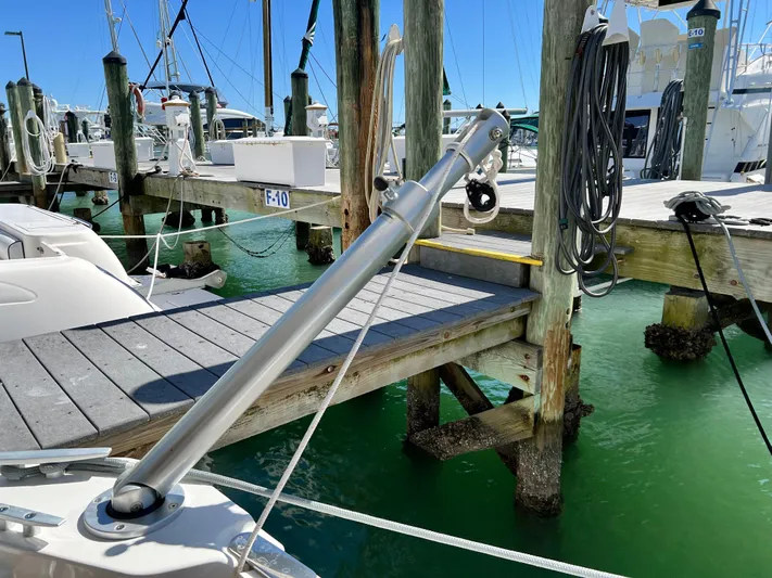  Yacht Photos Pics Beneteau Swift Trawler 35 (2021) docked at marina with clear water and wooden piers.