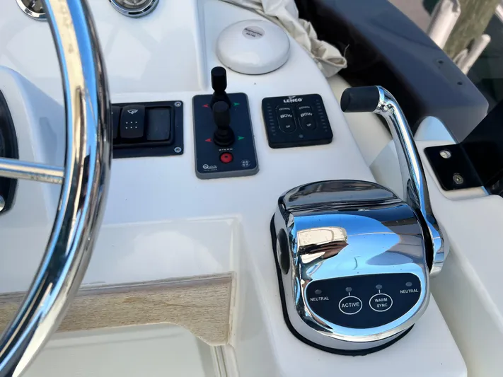  Yacht Photos Pics 2021 Beneteau Swift Trawler 35 helm controls and throttle.