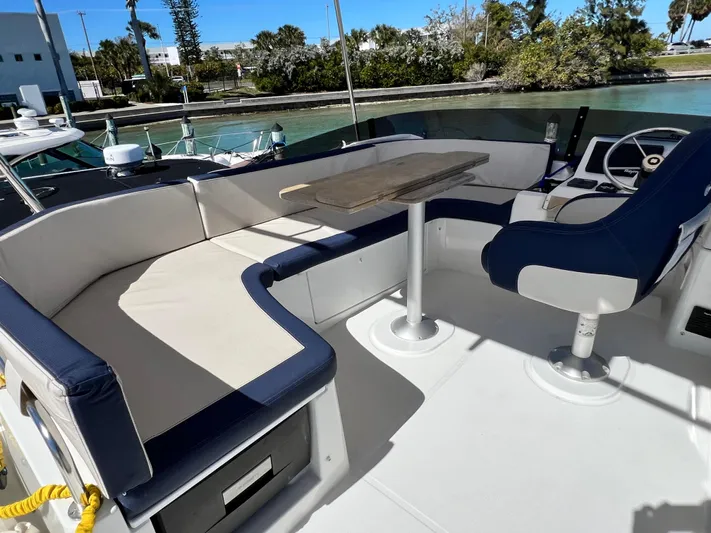  Yacht Photos Pics Beneteau Swift Trawler 35, 2021 model, outdoor seating area with table and helm station.