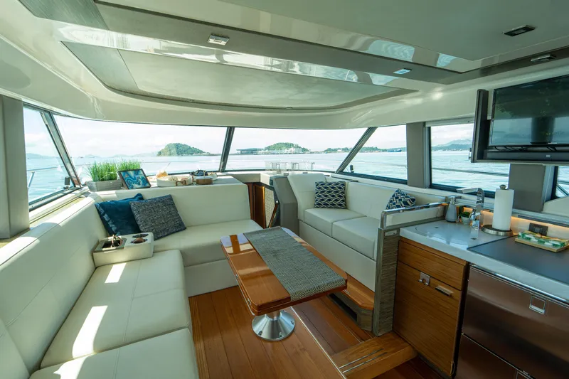  Yacht Photos Pics Luxurious interior of 2019 Tiara Yachts F44 Flybridge with elegant seating and panoramic windows.