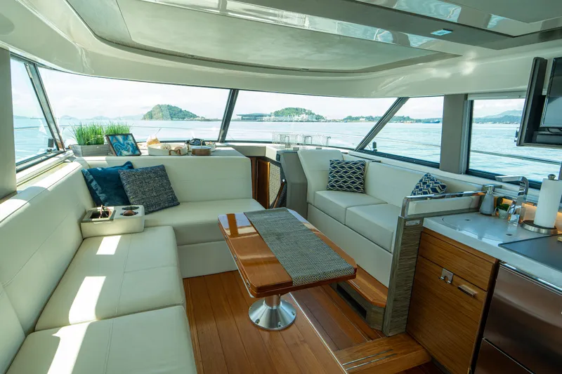  Yacht Photos Pics Luxurious interior of 2019 Tiara Yachts F44 Flybridge with elegant seating and ocean view.