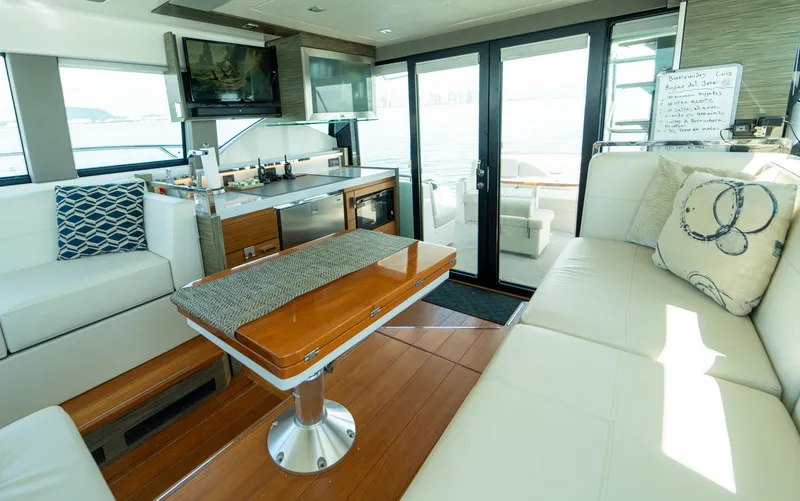  Yacht Photos Pics Luxurious interior of 2019 Tiara Yachts F44 Flybridge with elegant seating and modern amenities.
