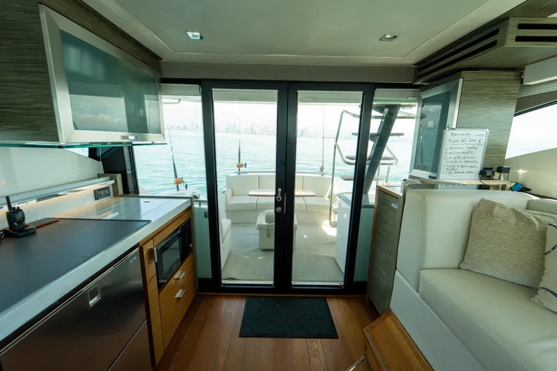  Yacht Photos Pics Interior of 2019 Tiara Yachts F44 Flybridge with modern kitchen and ocean view.
