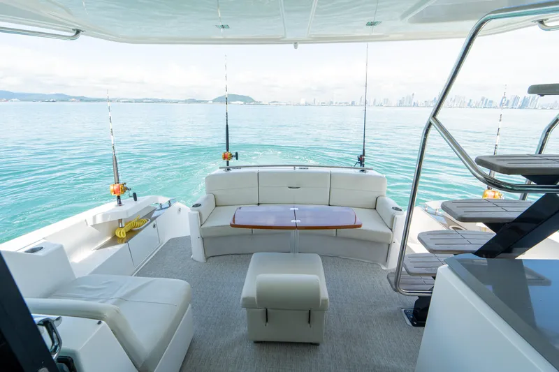  Yacht Photos Pics Luxurious 2019 Tiara Yachts F44 Flybridge interior with ocean view and comfortable seating.