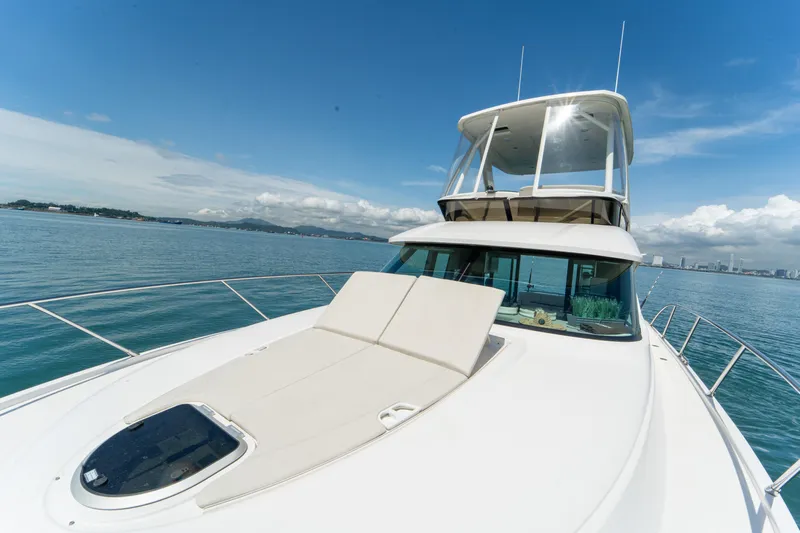  Yacht Photos Pics 2019 Tiara Yachts F44 Flybridge on calm sea with clear sky.