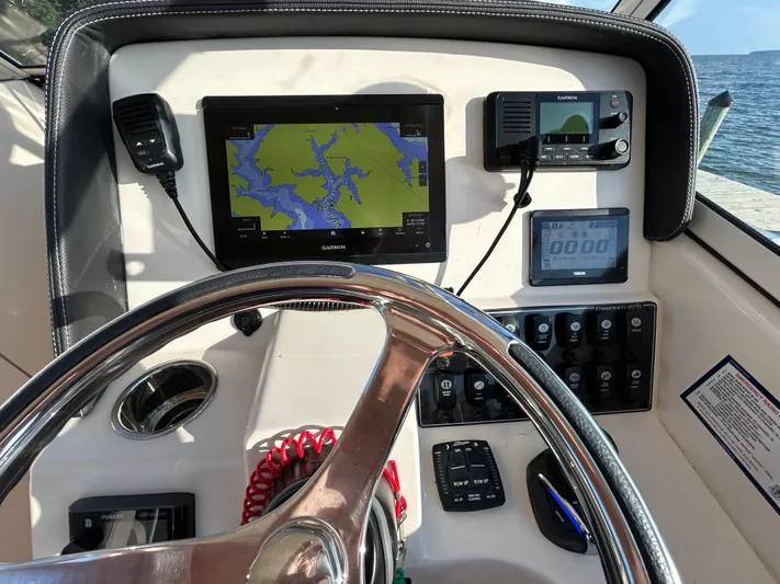  Yacht Photos Pics Dashboard of 2023 Grady-White Freedom 275 boat with navigation and control systems.