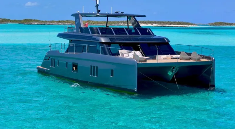  Yacht Photos Pics 2024 Sunreef 60 Eco yacht cruising in clear turquoise waters.