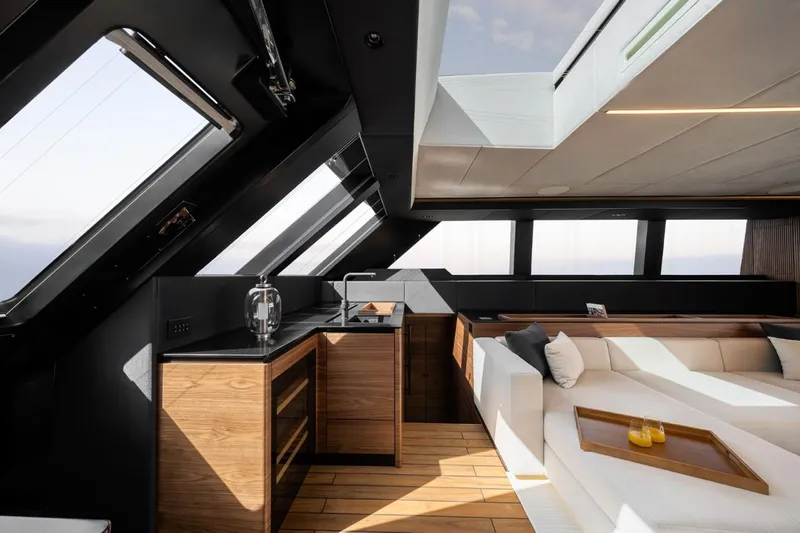  Yacht Photos Pics Luxurious interior of 2024 Sunreef 60 Eco yacht with modern kitchen and seating area.