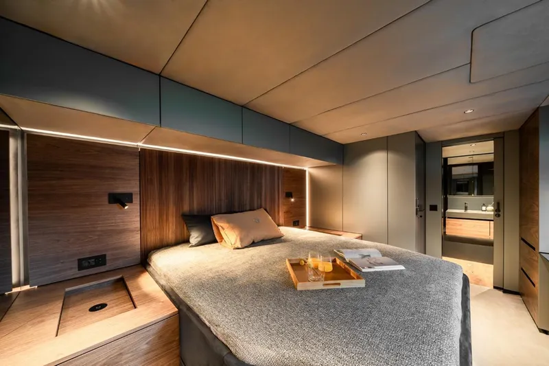  Yacht Photos Pics Luxurious bedroom interior of 2024 Sunreef 60 Eco yacht with modern design and ambient lighting.
