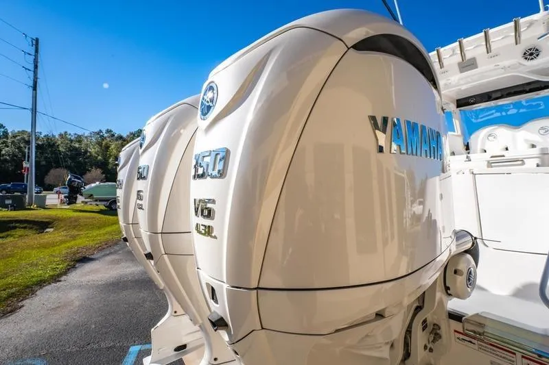  Yacht Photos Pics 2025 Edgewater 370CC with Yamaha 350 V6 outboard engines, parked outdoors.