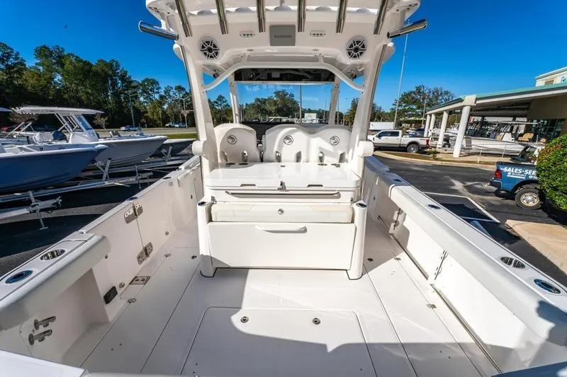  Yacht Photos Pics 2025 Edgewater 370CC boat interior with seating and storage, displayed outdoors.