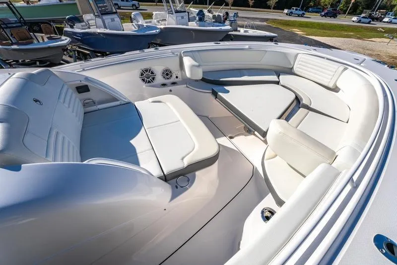  Yacht Photos Pics Luxurious seating area on 2025 Edgewater 370CC boat, featuring white upholstery and modern design.