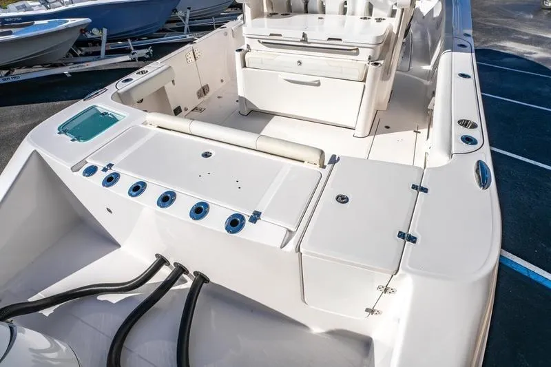  Yacht Photos Pics 2025 Edgewater 370CC boat interior with seating and storage compartments.