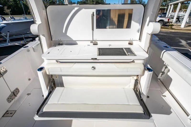  Yacht Photos Pics 2025 Edgewater 370CC boat interior with seating and grill station.