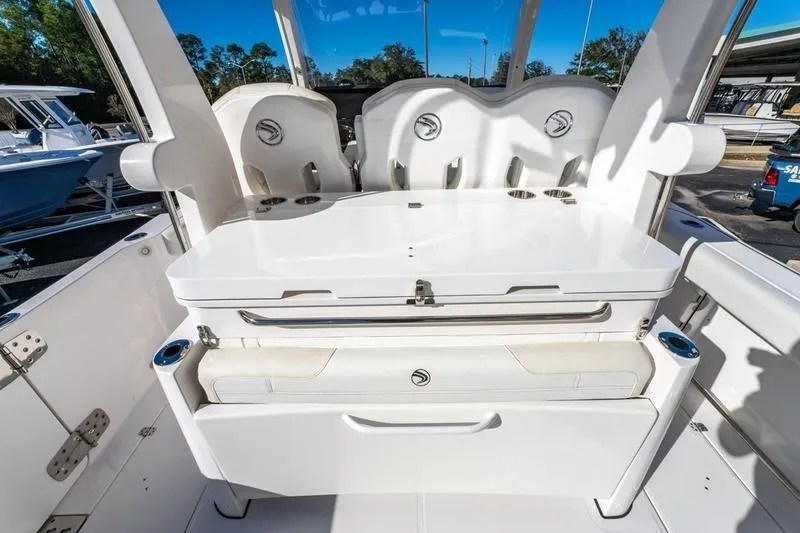  Yacht Photos Pics 2025 Edgewater 370CC boat interior with seating and storage compartments.