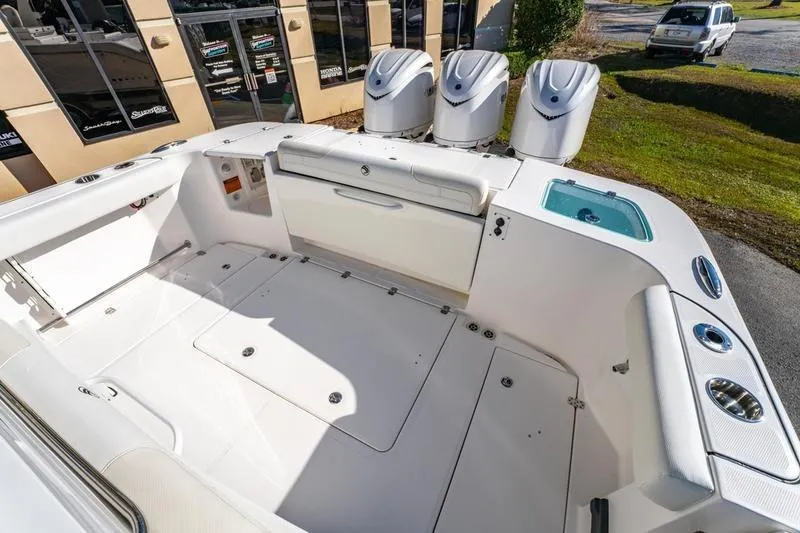  Yacht Photos Pics 2025 Edgewater 370CC boat interior with triple engines and spacious deck.